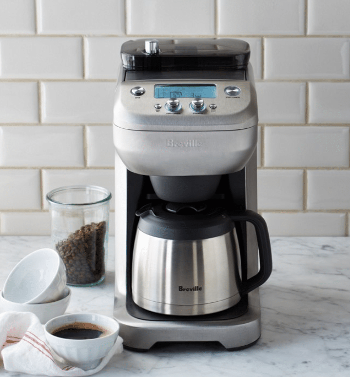 A sleek and modern Breville Grind Control 12-Cup Coffee Maker, presented as an ideal unique gift for doctors. The coffee maker features an integrated burr grinder and a digital control panel, emphasizing its advanced technology and convenience for busy professionals.